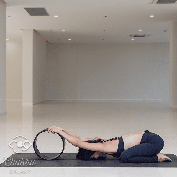 Yoga Wheel Assisted Child's Pose (Balasana)