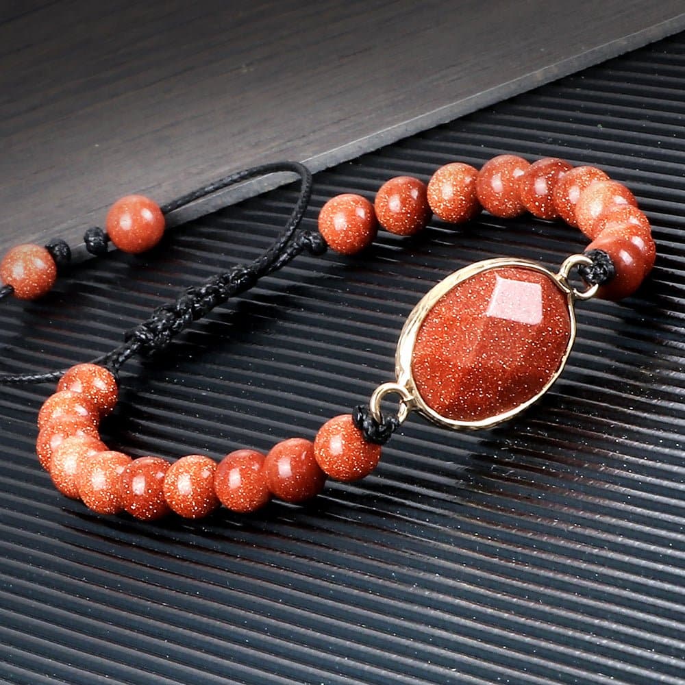 Oval-Shaped Red Goldstone 8mm Beads Braided Tibetan Bracelet